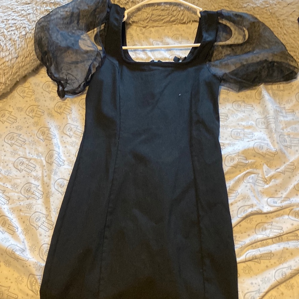 Black knee length dress with puffer sleeves